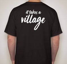 a man wearing a black t - shirt that says it takes a village on the back