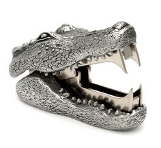 a silver alligator's head is shown on a white background with the mouth open