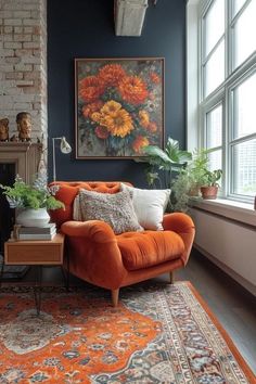 a living room with an orange couch and rug in front of a large painting on the wall