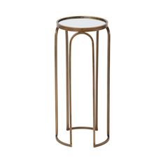 the side table has a glass top and gold metal frame, with a circular base