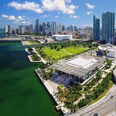 an aerial view of the city skyline and waterfront area in miami, with skyscrapers on both sides