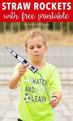 a young boy holding a toy rocket with the text straw rockets with free printable