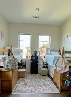 a room filled with lots of wooden furniture and windows next to a rug on top of a hard wood floor