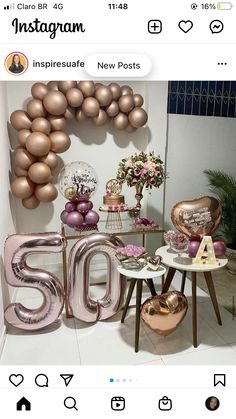 an instagram photo with balloons and letters on the wall in front of a table