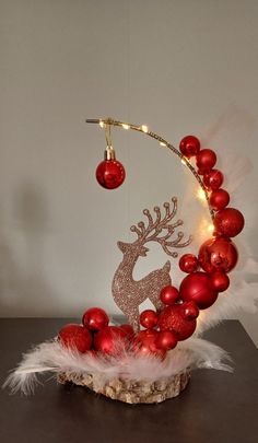 a christmas decoration with red ornaments and lights