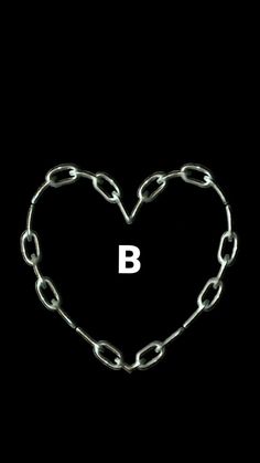 a heart shaped chain with the letter b on it