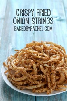 crispy fried onion strings on a white plate with the words, crispy fried onion strings