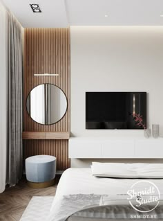 a bedroom with a bed, mirror and television on the wall