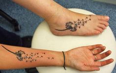 two people with tattoos on their feet and one is holding a dandelion tattoo