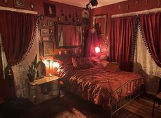 a bed room with a neatly made bed and red curtains