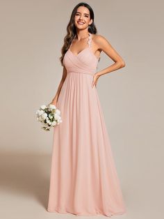 a woman in a long pink bridesmaid dress