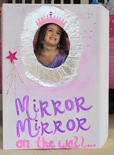 a child's photo in a mirror on the side of a cardboard box that says, mirror mirror on the wall