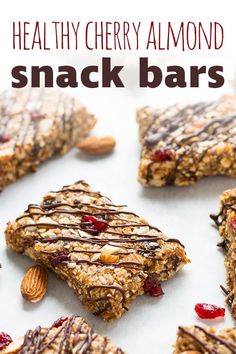 healthy cherry almond snack bars with nuts and chocolate drizzled on the top