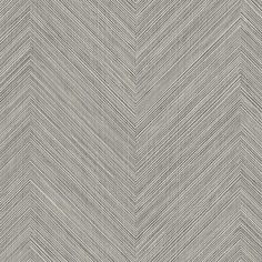 a chevroned wallpaper pattern in grey and white