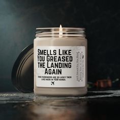 a candle that reads smells like you greased the landing again