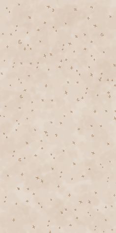 an abstract beige background with tiny stars