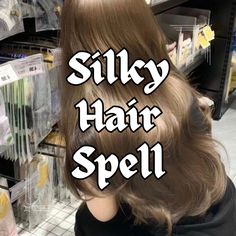 the back of a woman's head with silky hair spell