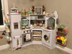 a play kitchen with lots of toys in it