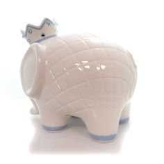 an elephant figurine with a crown on it's head, against a white background