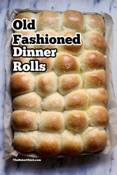 an old fashioned dinner rolls in a baking pan on a marble countertop with the words, old fashioned dinner rolls