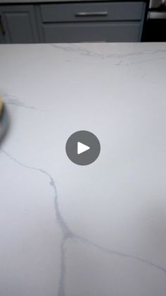 a white counter top with cracks in it