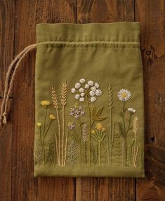 a small bag with some flowers on it