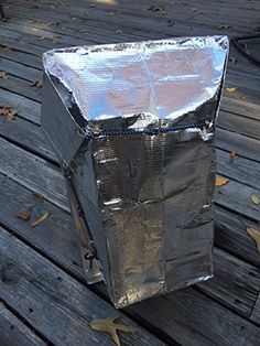 a piece of tin foil sitting on top of a wooden floor