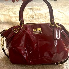 Coach Red Patent Leather Handbag. 2 Unnoticeable Stain Areas As Pictured. Gently Used. Designer Burgundy Bag With Detachable Strap, Red Coach Bag For On-the-go, Red Handheld Bag With Gold-tone Hardware, Red Handheld Bags With Gold-tone Hardware, Burgundy Bag With Detachable Strap And Double Handle, Coach Red Satchel With Detachable Handle, Coach Red Satchel With Detachable Strap, Burgundy Satchel Bag With Gold-tone Hardware, Red Coach Satchel With Top Handle