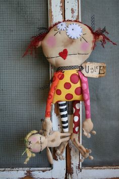 a stuffed doll hanging on the front door