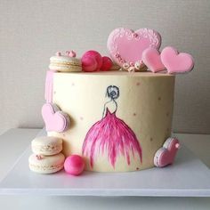 a decorated cake with macaroons and cookies