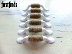 five white and brown toilet brushes lined up on a wooden table with the words firstfinds written above them