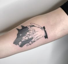 a couple of hands holding each other on top of a forearm tattoo designs for men