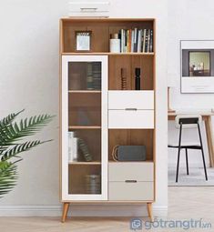 an open bookcase with books and magazines on it next to a potted plant