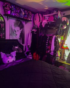 a bed room with a neatly made bed and purple lighting