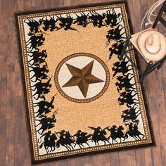 a cowboy themed rug with a star on it next to a hat, glasses and other items