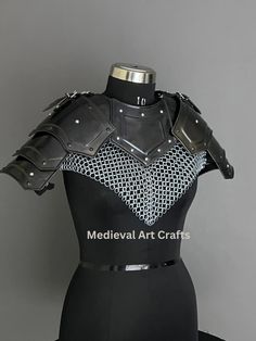 a black and white dress with armor on it