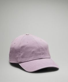 a pink hat on a gray background