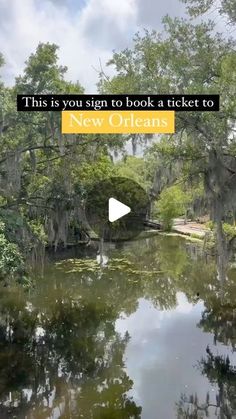 a river surrounded by trees with the words, this is you sign to book a ticket to new orleans