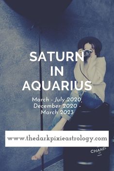 a woman sitting on top of a black barrel next to a wall with the caption saturn in aquarius