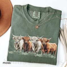 Embrace rustic charm with our Highland Cow shirt and sweatshirt collection! This funny cow shirt and sweatshirt, featuring the beloved Highlander cow, is perfect for Highland cow gifts and Scottish cow fans. This vintage Western farm-inspired design makes a great rodeo or everyday farm and calf shirt. **Note: FOR A RELAXED FIT, CHOOSE YOUR GO-TO SIZE. TO ACHIEVE AN OVERSIZED, LOOSE FIT, WE RECOMMEND GOING UP AT LEAST 1-2 SIZES. MODELS IN PHOTOS ARE WEARING 1-2 SIZES LARGER THAN THEIR GO-TO SIZE. Casual Fall T-shirt With Cow Print, Casual Cow Print T-shirt For Fall, Casual Cow Print Tops For Fall, Fall Cow Print Cotton Tops, Cow T Shirt, Highlander Cow, Cow Hoodie, Highland Cow Gifts, Scottish Cow