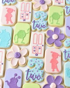 decorated cookies are displayed on a white surface