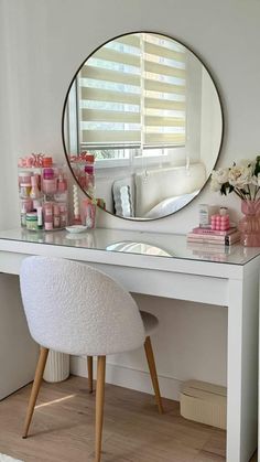 a white desk with a mirror on top of it