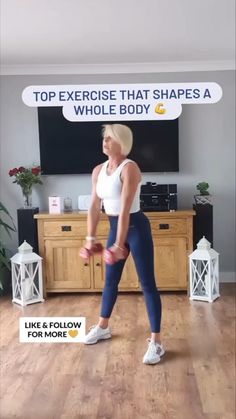 a woman is doing exercises with dumbs in front of a tv and the words, top exercise that shapes a whole body like & follow for more