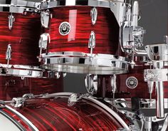 a close up of a red drum set