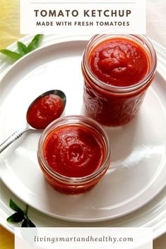 two jars of tomato sauce on a white plate