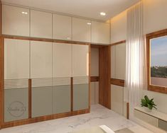 an empty room with white cabinets and marble counter tops, along with a large mirror on the wall