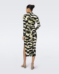 Made from matte jersey, the Sonja midi dress has a soft feel and a smooth finish. This piece has a high neck, long sleeves, and a close fit. Knotted detail gathers at the hip for an extra edge.Eloisa is 5 Foot and 8 Inches and wearing a size XS. Wrap Dress Dvf, Side Twist, Lupita Nyong, Stylist Outfit, Abstract Print Dress, Midi Wrap Dress, Long Sleeve Turtleneck, Bodycon Midi, Wrap Dress Floral