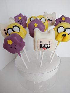 the cake pops are decorated like cartoon characters