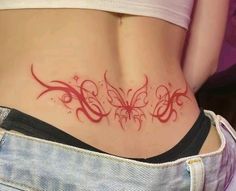 a woman's stomach with an intricate tattoo design on the bottom and lower back