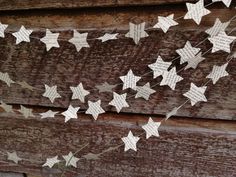 some white paper stars hanging from a string